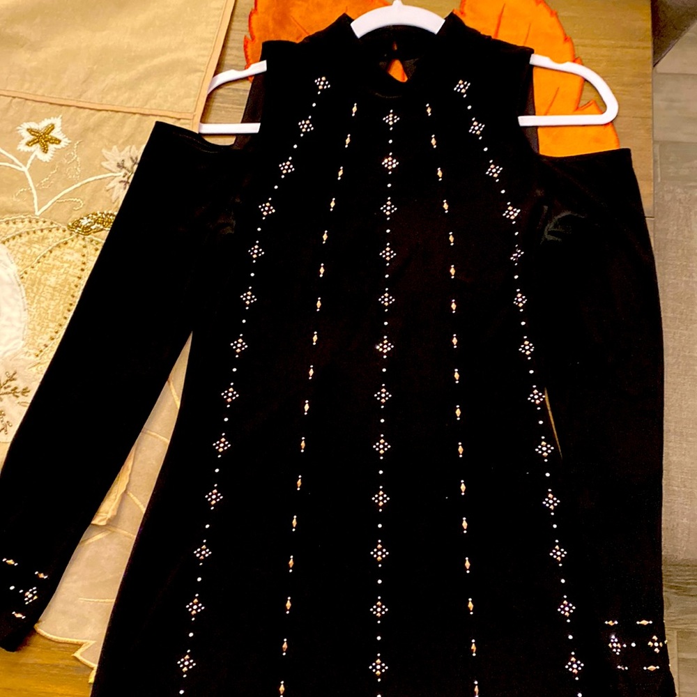 Black dress with beautiful studded details throughout!